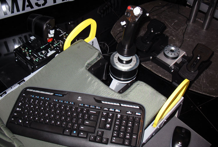 Another view. Note the mounting of the stick and the Saitek Pro Flight rudder pedals paired with the HOTAS Warthog.